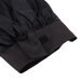 A black chef hat with a black band and strap.