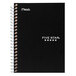 A black Mead notebook with white writing on the cover and a spiral binding.
