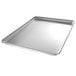 A Chicago Metallic full size aluminum sheet pan with a band in rim on a counter.