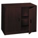 A dark brown HON 10500 Series laminate wood storage cabinet with two doors.