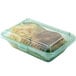 A jade green plastic GET Eco-Takeouts container with food in it.