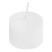 A white Leola votive candle in a clear candle holder.