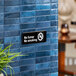 A Vollrath Traex No Smoking sign on a wall.