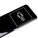 A black rectangular Vollrath men's restroom sign with a white man's silhouette on it.