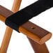 A black strap on an American Metalcraft walnut wood tray stand frame.