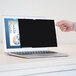 A hand holding a black screen of a laptop.