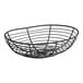 A Clipper Mill black powder coated iron wire basket with a curved edge and handle.