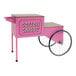 A pink Benchmark USA cotton candy cart with wheels.