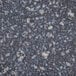 A close-up of a black and white speckled marbled surface.