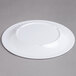 a white plate on a white surface