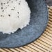 A rectangular blue stoneware bread and butter plate with rice on it.