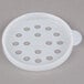 A white plastic lid with holes.