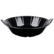 a black bowl with a scalloped edge