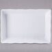 A white rectangular tray with wavy edges.