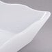 A white rectangular scalloped melamine tray.