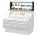 A black 63-inch Turbo Air TOMD-60-HB top dry display case for showcasing bakery items or snacks.