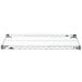 A white rack with a metal grid.