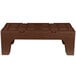 A brown plastic bench with holes.