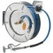 A T&S stainless steel hose reel with a hose attached.