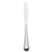 A silver dinner knife with a white handle.