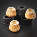 A group of small Kugelhopf cakes in Matfer Bourgeat mini bundt cake molds.