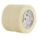 A close-up of a roll of Universal general purpose masking tape with clear labels.