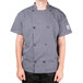 A man wearing a Chef Revival short sleeve chef jacket with a mesh back.