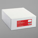 A white Universal business envelope box with a red label.