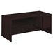 A mahogany HON pedestal desk with a drawer.