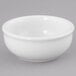 A Tuxton porcelain white sauce dish.