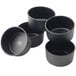 A group of black Matfer Bourgeat mini cake pans.