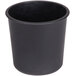 A black plastic pot sitting on a table.