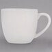 A white mug with a handle.