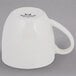 A white Tuxton Milano mug with a black handle.