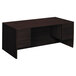 A dark brown HON 10500 Series double pedestal desk with two drawers.