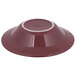 A red Tuxton pasta bowl with a white rim.