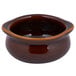 A Tuxton caramel ceramic onion soup crock with a brown rim.