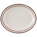 A white Tuxton china platter with brown speckled rim.