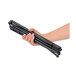 A hand holding a bundle of black poles with adjustable clips.