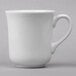 A Libbey Basics tall white porcelain cup with a handle.