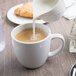 A white porcelain Libbey mug being poured into.