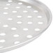 An American Metalcraft aluminum pizza pan with holes in it.