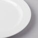 A close-up of a Libbey bright white porcelain plate with a thin rim.