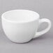 A close-up of a Libbey white porcelain espresso cup with a handle.