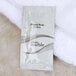 A white Dial package of lotion on a white towel.