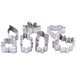 A group of metal cookie cutters on a white background, including leaf shapes.