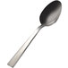 A close-up of a Bon Chef Roman stainless steel serving spoon with a white handle.