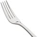 A close-up of a Bon Chef stainless steel dinner fork with a silver handle.