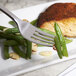 A Bon Chef Aspen dinner fork on a plate with salmon and green beans.