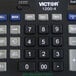 A Victor 12-digit desktop calculator displaying the number 1212.